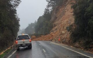 landslide over a road with car stopped