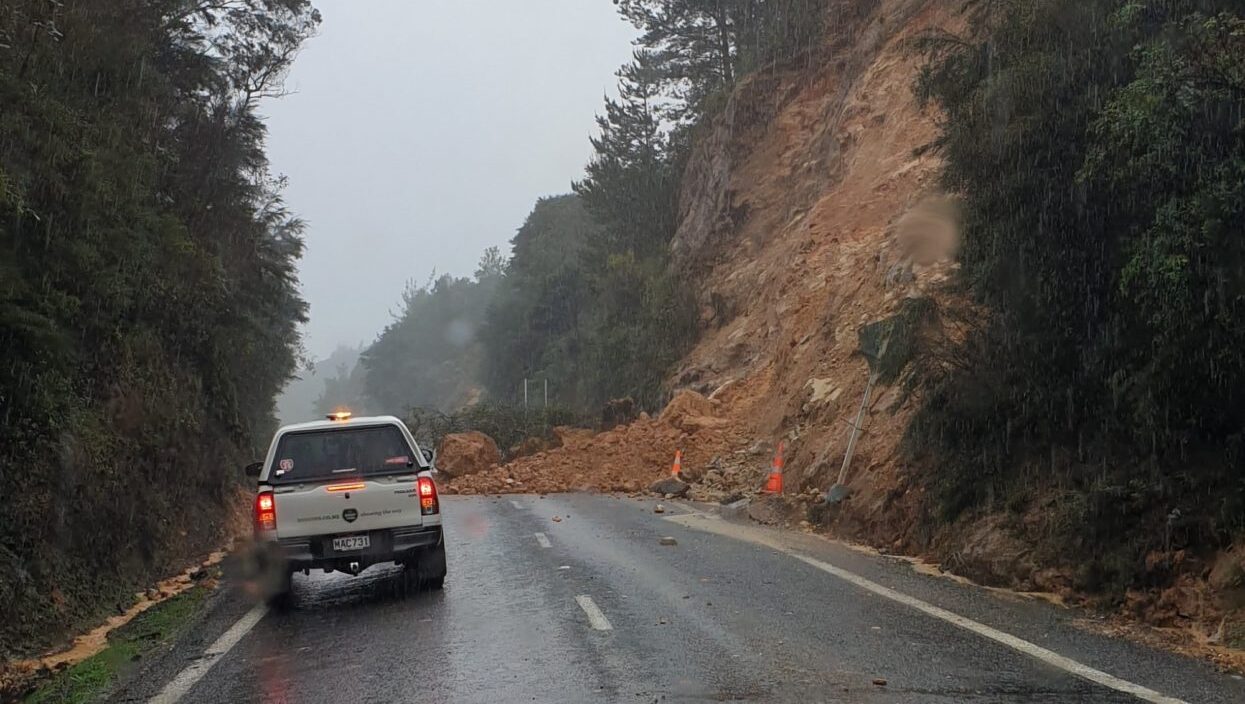 landslide over a road with car stopped